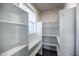 Walk-in pantry features wooden floors, white shelves and cabinets and a window for natural light at 52 N Rosebank Dr, Chapel Hill, NC 27516