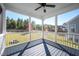 Spacious screened-in porch with backyard view and a ceiling fan for outdoor relaxation at 52 N Rosebank Dr, Chapel Hill, NC 27516