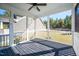 Inviting screened porch with a view of the backyard, offering a perfect blend of indoor and outdoor living at 52 N Rosebank Dr, Chapel Hill, NC 27516