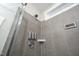 This shower features a shower dispenser and gray wall tiles at 52 N Rosebank Dr, Chapel Hill, NC 27516