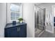 A tiled shower with a glass door and a window at 52 N Rosebank Dr, Chapel Hill, NC 27516