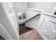Staircase with window storage bench and a combination of carpet and hardwood floors at 52 N Rosebank Dr, Chapel Hill, NC 27516