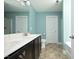 The bathroom features a double vanity and a separate toilet and shower area at 5204 Sapphire Springs Dr, Knightdale, NC 27545