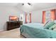 Comfortable bedroom featuring vaulted ceilings, a ceiling fan, and access to the ensuite bathroom at 5216 Passenger Pl, Raleigh, NC 27603