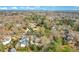 Gorgeous neighborhood aerial view featuring beautifully landscaped yards and mature trees under a vibrant sky at 527 N Main St, Wake Forest, NC 27587