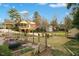 Expansive backyard featuring a garden, shed, and surrounding trees, offering a private outdoor space at 527 N Main St, Wake Forest, NC 27587