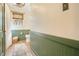 Bathroom with wainscoting featuring a toilet and patterned rug at 527 N Main St, Wake Forest, NC 27587