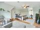 Spacious primary bedroom with neutral tones, ceiling fan and lots of natural light at 527 N Main St, Wake Forest, NC 27587