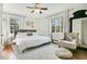Serene bedroom featuring a large bed, stylish furnishings, and natural light at 527 N Main St, Wake Forest, NC 27587