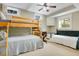 Charming bedroom with a bunk bed, single bed, desk and windows, perfect for a ' room at 527 N Main St, Wake Forest, NC 27587