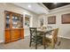 Cozy dining area with stylish table and chairs, complemented by a classic china cabinet at 527 N Main St, Wake Forest, NC 27587