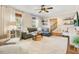 Inviting living room featuring a plush rug, comfortable seating, and large windows at 527 N Main St, Wake Forest, NC 27587