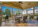 Outdoor patio with dining table, chairs, and string lights, ideal for relaxing and entertaining at 527 N Main St, Wake Forest, NC 27587