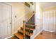 Wooden staircase with elegant railing leading to the upper levels of the home at 527 N Main St, Wake Forest, NC 27587