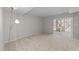 Basement features carpet, sliding glass door, and natural lighting from back of the home at 5421 Vista View Ct, Raleigh, NC 27612