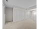 Neutral carpeted basement featuring closet doors and modern lighting, perfect for customization at 5421 Vista View Ct, Raleigh, NC 27612