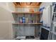 Basement storage area with wood shelving and concrete walls, perfect for organizing household items at 5421 Vista View Ct, Raleigh, NC 27612