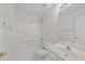 Clean, bright bathroom with white fixtures including a tub/shower combo and a vanity with ample counter space at 5421 Vista View Ct, Raleigh, NC 27612