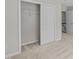 Bedroom featuring closet with bifold doors, neutral paint, carpet, and access to hallway at 5421 Vista View Ct, Raleigh, NC 27612
