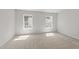 Bedroom with 2 windows allowing natural light with carpet and neutral paint colors at 5421 Vista View Ct, Raleigh, NC 27612