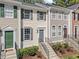 Charming townhouse facade with classic architectural details, tidy landscaping, and inviting entrance at 5421 Vista View Ct, Raleigh, NC 27612
