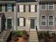 Charming townhome featuring neutral siding, dark shutters, and a welcoming front entrance with steps at 5421 Vista View Ct, Raleigh, NC 27612