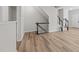 Spacious living area featuring wood floors, staircase, and an open layout at 5421 Vista View Ct, Raleigh, NC 27612