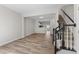 Open-concept living space featuring modern wood floors and staircase leading to the upper level at 5421 Vista View Ct, Raleigh, NC 27612