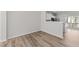 Bright living area with wood flooring showcasing an open layout with seamless flow to the kitchen and dining at 5421 Vista View Ct, Raleigh, NC 27612