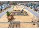 Aerial view showcases community garden with plots and sheds and surrounding homes and neighborhood layout at 562 Boulder Point Dr, Chapel Hill, NC 27516