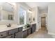 Bathroom showcasing double sink vanity with a window view and a walk-in closet at 562 Boulder Point Dr, Chapel Hill, NC 27516