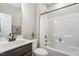 Bathroom features a shower-tub combo and decorative storage at 562 Boulder Point Dr, Chapel Hill, NC 27516