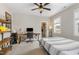 Bedroom includes a ceiling fan, home office setup and closet with storage at 562 Boulder Point Dr, Chapel Hill, NC 27516