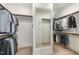 Walk-in closet with ample storage and clothing racks, featuring a full-length mirror at 562 Boulder Point Dr, Chapel Hill, NC 27516