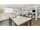 Bright kitchen island features an undermount sink and quartz countertops at 562 Boulder Point Dr, Chapel Hill, NC 27516
