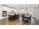 Spacious kitchen with a large center island, pendant lighting, stainless appliances and hardwood floors at 562 Boulder Point Dr, Chapel Hill, NC 27516