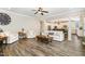 Bright living room featuring hardwood floors and a view of the modern, white kitchen at 562 Boulder Point Dr, Chapel Hill, NC 27516