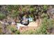 Stunning aerial view of the property featuring a pool and wooded surroundings at 5640 Bella Terra Ct, Wake Forest, NC 27587