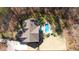 Aerial view showcasing the house, pool, and landscaped backyard oasis at 5640 Bella Terra Ct, Wake Forest, NC 27587