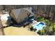 Aerial view of a home's backyard featuring a pool, patio, and well-maintained landscaping at 5640 Bella Terra Ct, Wake Forest, NC 27587
