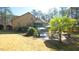 Stunning backyard with brick house, patio, pool and mature landscaping provides a private outdoor oasis at 5640 Bella Terra Ct, Wake Forest, NC 27587