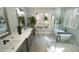 A beautifully designed main bath with large tub, glass shower, double sink, and a view at 5640 Bella Terra Ct, Wake Forest, NC 27587