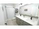 Bright bathroom with double vanity, quartz countertops, and a large mirror at 5640 Bella Terra Ct, Wake Forest, NC 27587