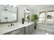 A bathroom featuring double sinks, grey cabinetry, and modern fixtures at 5640 Bella Terra Ct, Wake Forest, NC 27587