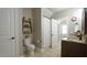 Comfortable bathroom featuring a ladder shelf and toilet in neutral tones at 5640 Bella Terra Ct, Wake Forest, NC 27587