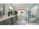 A beautifully designed main bath with large tub, glass shower, double sink, and a view at 5640 Bella Terra Ct, Wake Forest, NC 27587