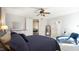 Primary bedroom boasts hardwood floors, sitting area, and ensuite bathroom access at 5640 Bella Terra Ct, Wake Forest, NC 27587