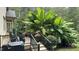 Spacious deck with stairs is surrounded by mature landscaping, ideal for outdoor entertaining and relaxation at 5640 Bella Terra Ct, Wake Forest, NC 27587