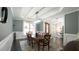 Elegant dining room featuring a rectangular chandelier, neutral color palette, and adjacent views of the front office at 5640 Bella Terra Ct, Wake Forest, NC 27587