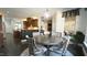 Dining room with chandelier, hardwood floors and easy access to kitchen and patio at 5640 Bella Terra Ct, Wake Forest, NC 27587